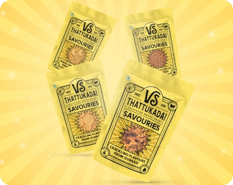 VS Thattukadai snack packs with bowls of mixture and thattai on a red tabletop